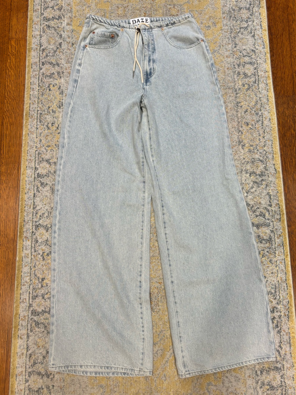 Daze Denim size 24, Light Wash Women’s Jeans - wide leg. Draw string belt.
